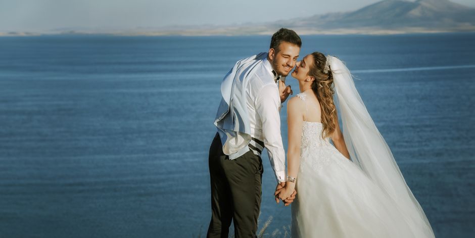 Captivating wedding moment of a joyful couple by the seaside in Ankara.